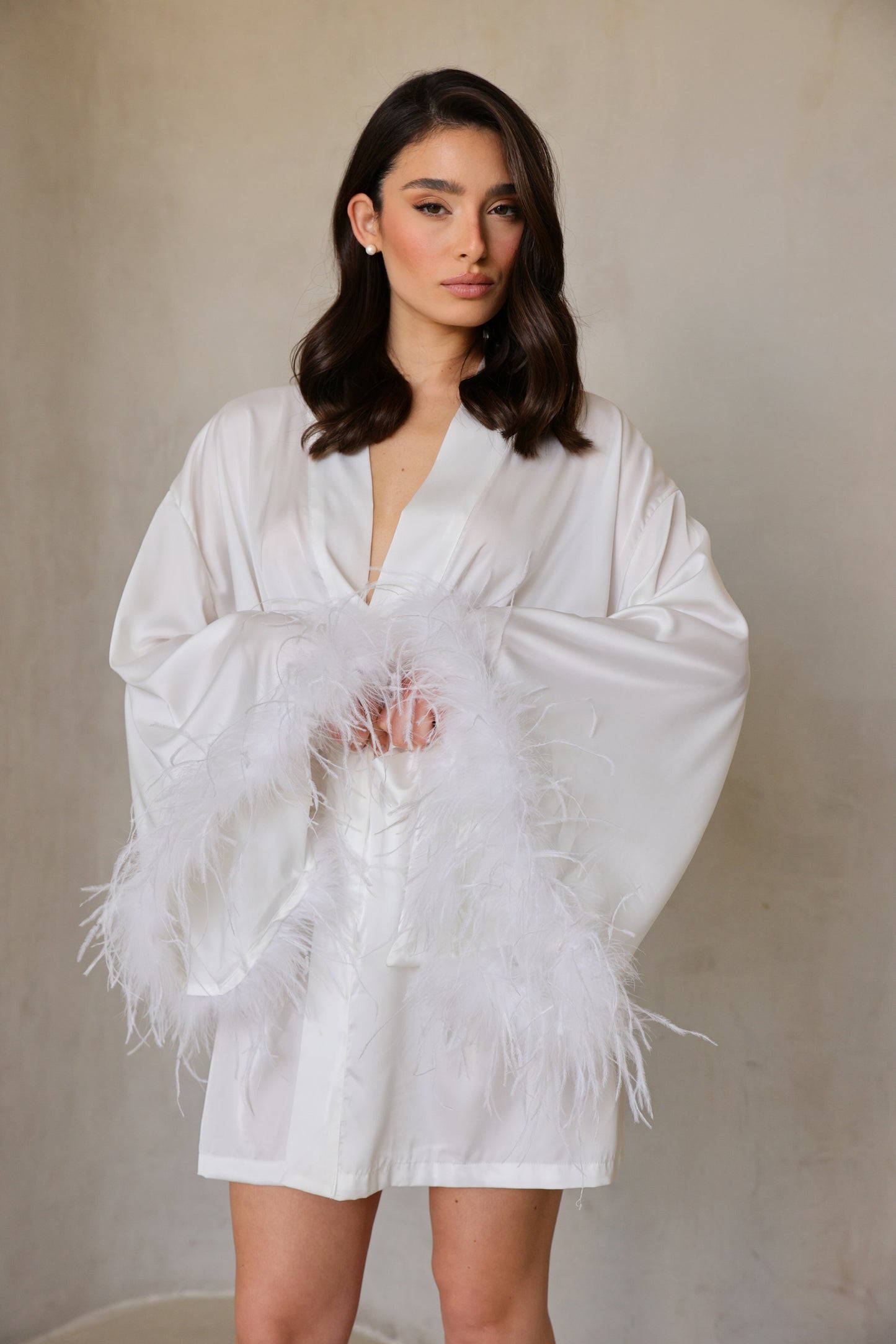 Detail shot of Swan robe’s ostrich-feather cuff trim.