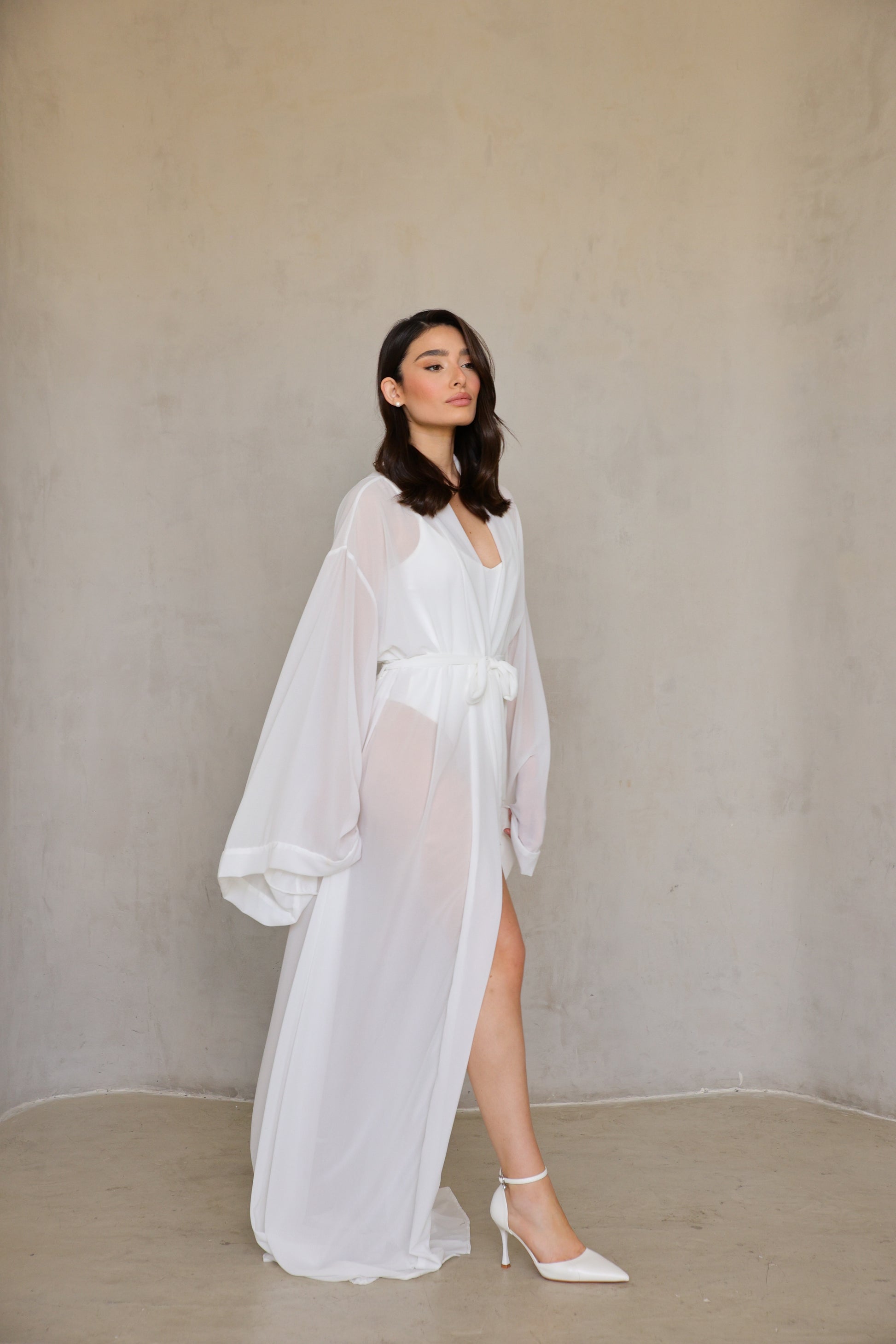 Angel Robe - walking motion shot, front slit reveals leg as fabric billows