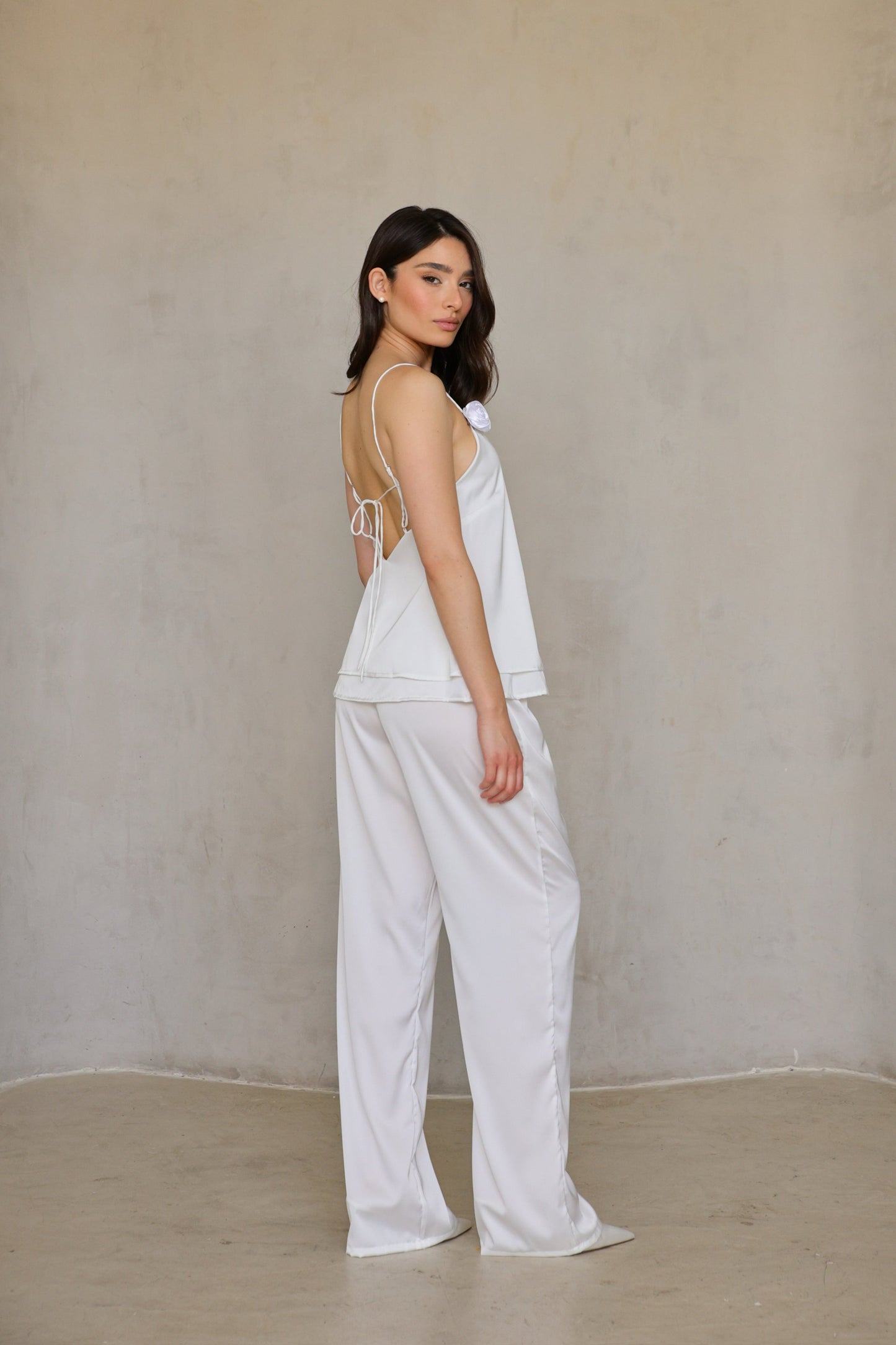 angle-miss-mariee.jpg	Ivory Rose satin pants front angle—model slightly turned with hand on hip