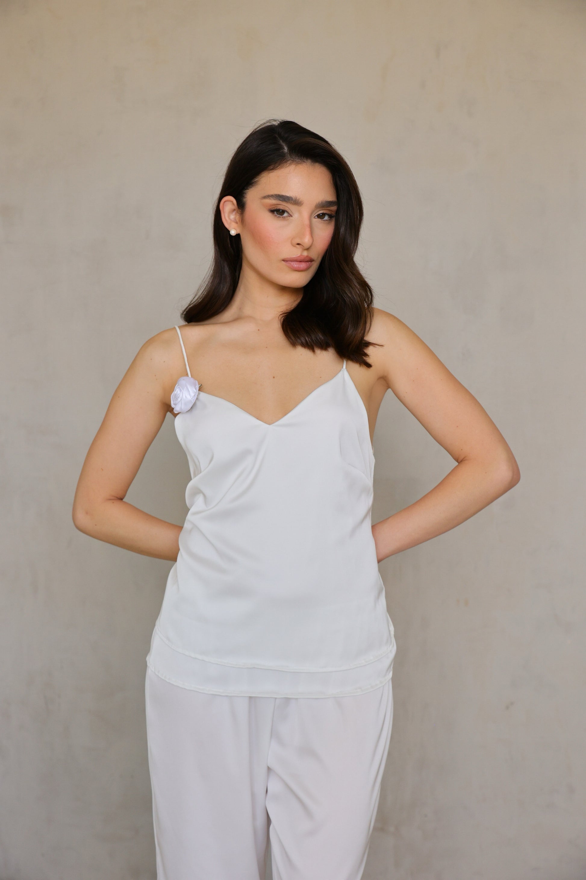 Ivory Rose satin top – three-quarter front pose, hand on hip